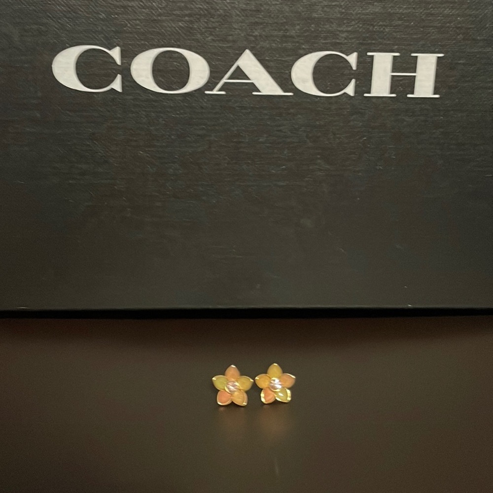 Coach gold flower earrings.